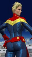 breasts giantess city mega blonde butt blue_eyes buildings gloves short_hair thighs costume belt looking_behind stuck_to_butt digital_render marvel_comics roodedude captain_marvel carol_danvers