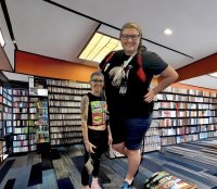 breasts giantess collage blonde glasses shoes mini_giantess bbw shorts indoors purse tattoo earrings looking_at_viewer hands_on_hips bare_legs bare_midriff bluemananthony26