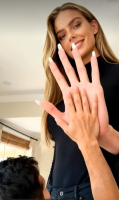 gentle clothed brunette mini_giantess hand looking_down size_comparison manicure ai_art giantess shrunken_man height_difference hand_compare