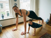 gentle clothed barefoot cleavage mini_giantess pants living_room looking_at_viewer apartment sports_bra exercising ai_art tall_tales