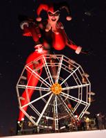 breasts giantess city mega large_breasts helicopter gloves harley_quinn mask night thighs ferris_wheel crowds jetslasher stars running_away haning_on digital_render dc_comics looking_at_tinies raygun anttiergod