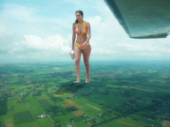 giantess mega black_hair swimsuit barefoot town airplane rural nature