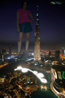 breasts giantess collage city mega black_hair destruction barefoot skirt glasses burj_khalifa jets short_skirt lake dark_skin night beregous hands_on_hips
