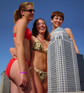 city long_hair swimsuit multiple_giantesses brunette smiling short_hair navel laughing sunglasses sunny
