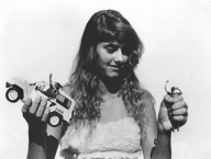 breasts giantess collage monochrome long_hair handheld movie helpless edison fist top kidnapping looking_at_tiny