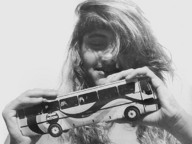 giantess collage mega monochrome long_hair handheld bus vehicles edison