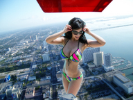 gentle giantess city black_hair swimsuit legs belly