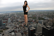 giantess collage city brunette smiling spike_heels little_black_dress