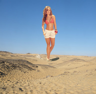 giantess collage blonde helicopter desert wonderslug shorts walking sand sky sunny flip_flops melissa_giraldo swimsuit_top