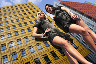 giantess collage city blonde black_hair low_angle giantesses hands_on_hips